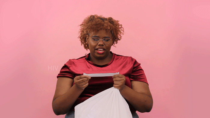 Gif of women reading "HIV Impacts Every Community" off a slip of paper, pulled out of a pillow