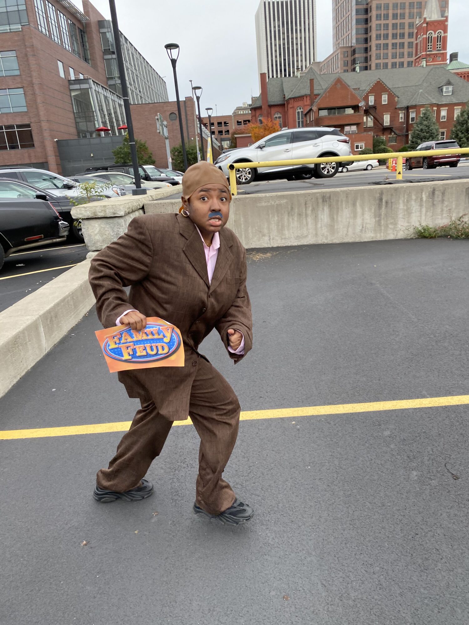 Raven as Steve Harvey once again is running from someone in the parking lot
